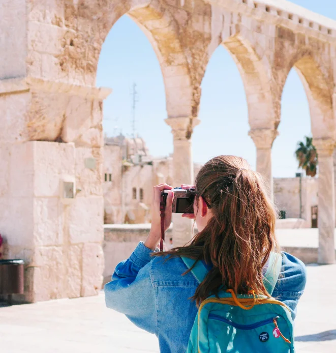 A vacationing photographer taking a picture.